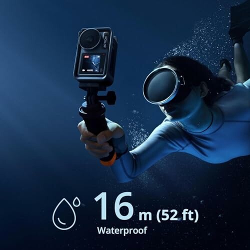 Person underwater holding an action camera with waterproof capability of 16 meters (52 feet).