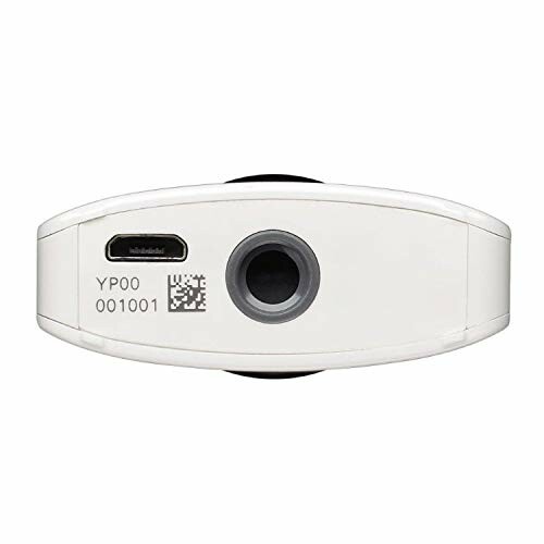 Bottom view of a white camera with a USB port and barcode.